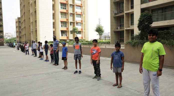 Citizens from Vasant Oasis specially kids and women marched in the morning carrying black flags to protest against builder's arbitrary parking policy
